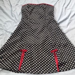 Strapless black polka dot dress w/ red trim